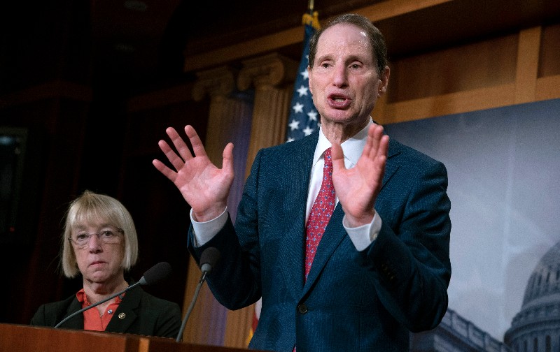 In this Dec. 19, 2018, file photo, Sen. Ron Wyden, D-Ore., joined at left by Sen. Patty Murray, D-Ore., speaks during a news conference to press Congress to intervene on behalf of the Affordable Care Act, after a federal judge in Texas ruled it unconstitutional, on Capitol Hill in Washington. Wyden has proposed legislation that would give states a free hand to allow legal marijuana markets without the threat of federal criminal intervention. (AP Photo/J. Scott Applewhite, File)