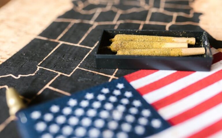 A US map, American flag and cannabis prerolls