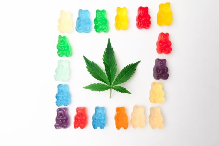 cannabis leaf surrounded by a square of candy gummy bears on a white background