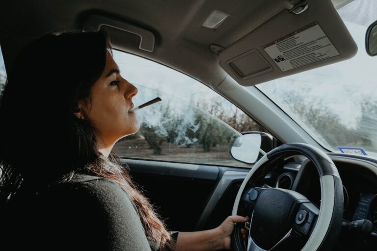 Girl smokes in her car